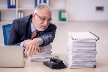 Old male employee and too much work at workplace