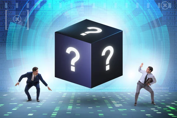 Businessman in the question concept with cube