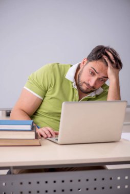Young teacher student in the classroom