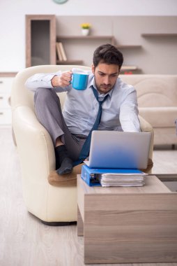 Young employee working from home during pandemic