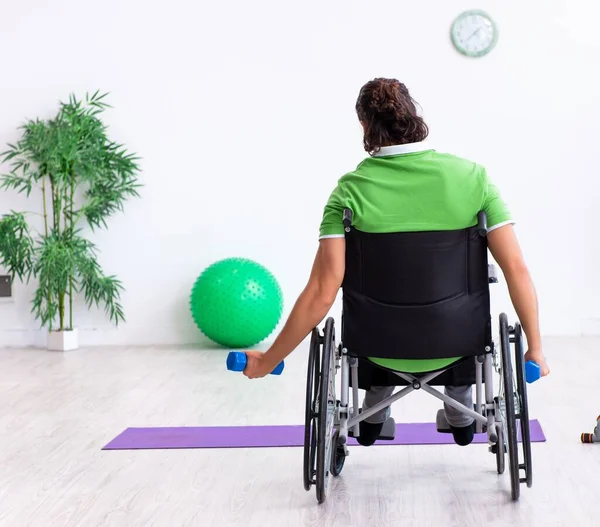 Young Man Wheel Chair Doing Exercises Indoors — Stock Photo, Image