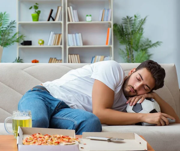 stock image The man eating pizza having a takeaway at home relaxing resting