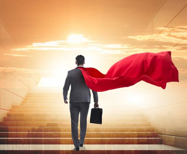 The businessman superhero successful in career ladder concept