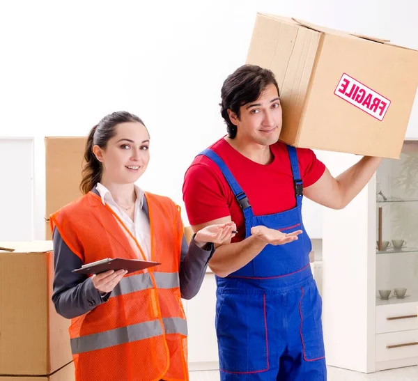 stock image The professional movers doing home relocation