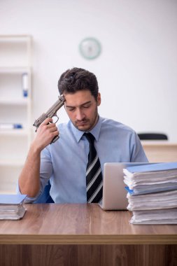 Young businessman employee committing suicide in the office