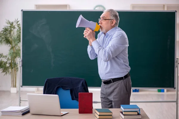 Old Teacher Holding Megaphone Classroom — Stok fotoğraf