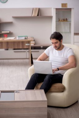 Young employee working from home during pandemic