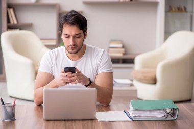 Young employee working from home during pandemic