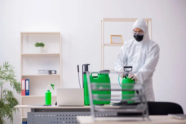 Young Contractor Disinfecting Office Pandemic — Stockfoto