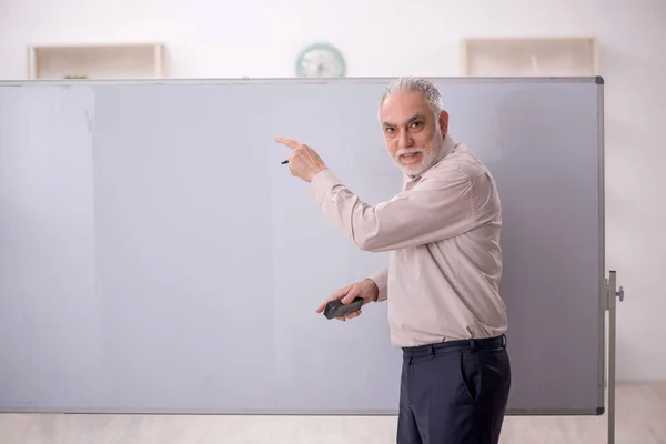 stock image Old teacher in the classroom