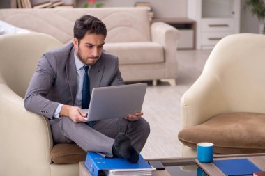 Young employee working from home during pandemic