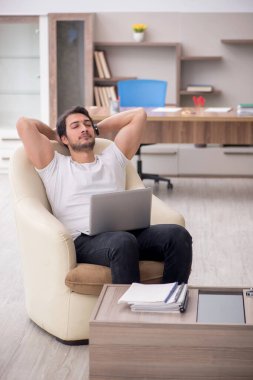 Young employee working from home during pandemic