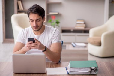 Young employee working from home during pandemic