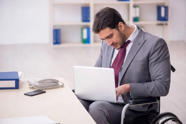 Young Male Employee Wheel Chair Working Workplace — Stockfoto