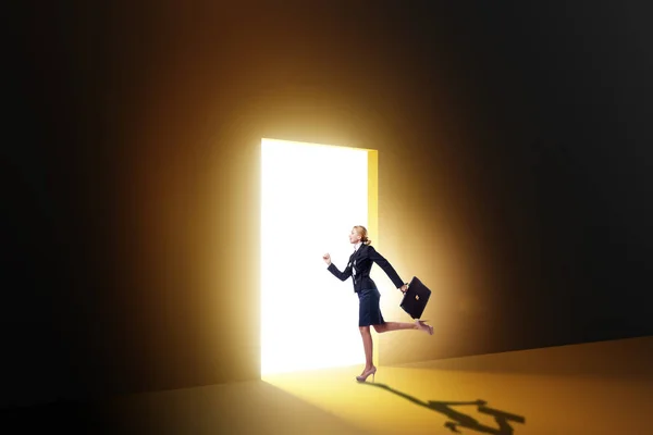 Businesswoman Entering Backlit Door Escape Concept — Stock Photo, Image