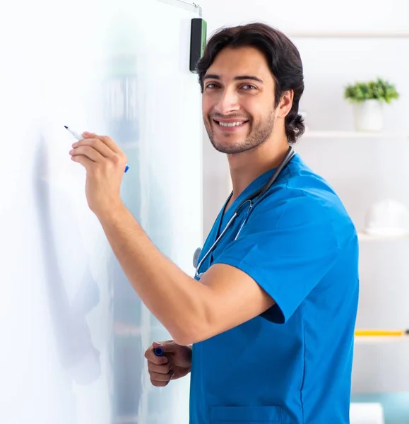 Young Male Doctor Front Whiteboard — Stockfoto