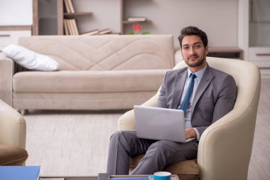 Young employee working from home during pandemic