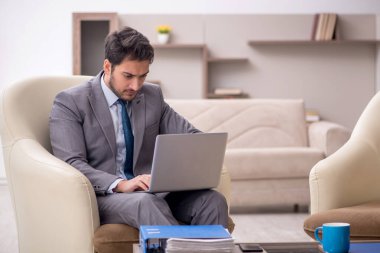 Young employee working from home during pandemic