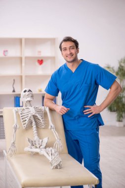 Young doctor and skeleton patient at the hospital