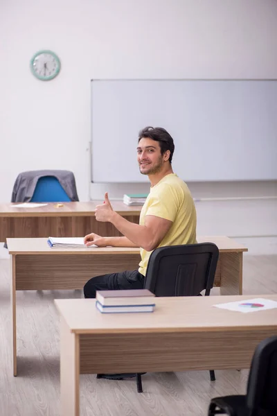 Young Student Teacher Sitting Classroom — Stockfoto