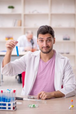 Two chemists working at the lab