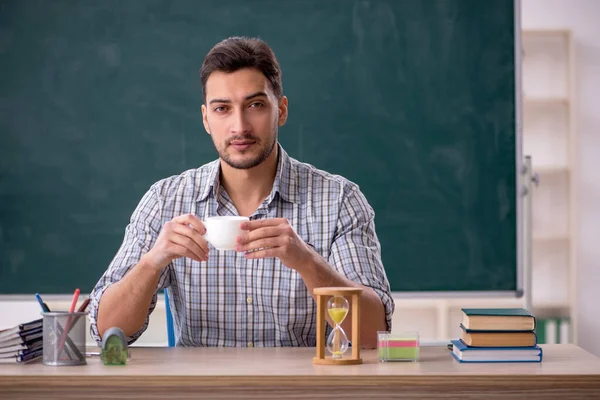 Young Teacher Drinking Tea Classroom — Stockfoto
