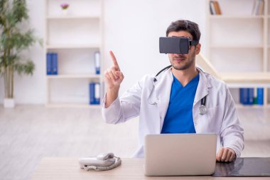 Young doctor enjoying virtual glasses at the hospital