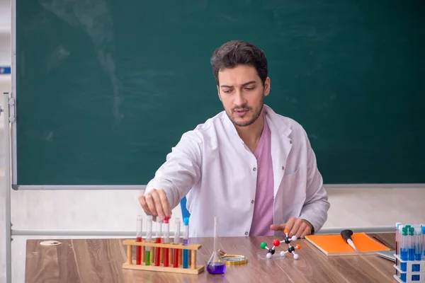 Young Chemistry Teacher Sitting Classroom —  Fotos de Stock