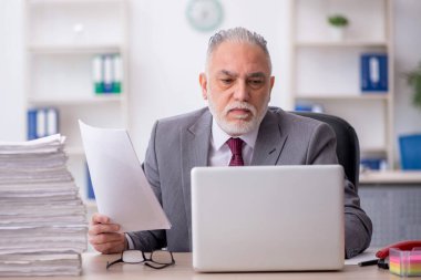Old employee unhappy with excessive work at workplace
