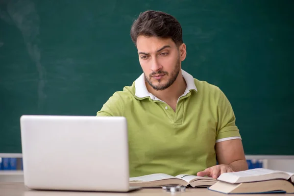 Young Student Sitting Front Green Board — Stock Photo, Image