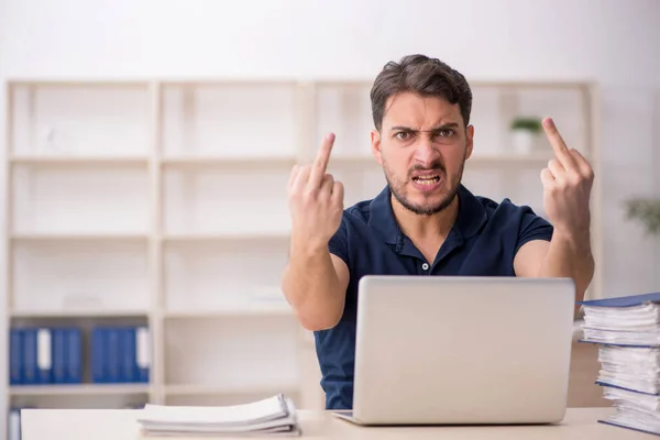 Stock image Young employee sitting at workplace