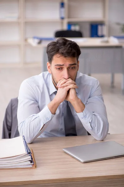 stock image Young employee working at workplace