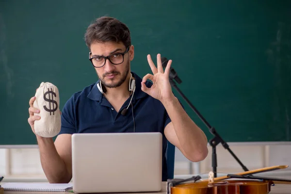 Young Music Teacher Holding Moneybag Classroom — Stock Photo, Image