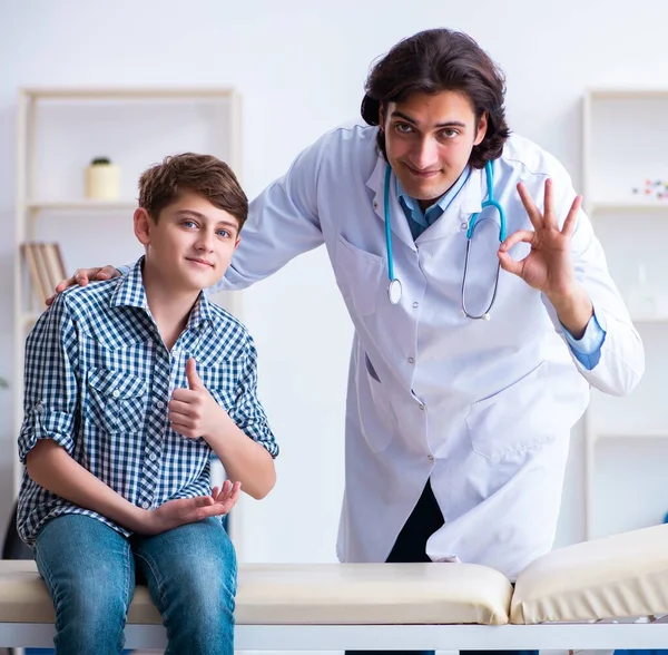 Young Doctor Examining Schoolboy Regular Check — Stock Photo, Image
