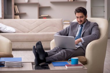 Young employee working from home during pandemic