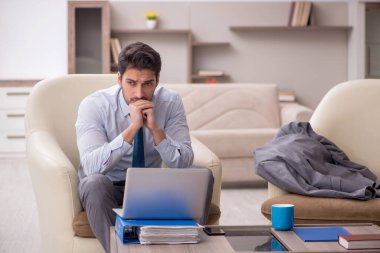 Young employee working from home during pandemic