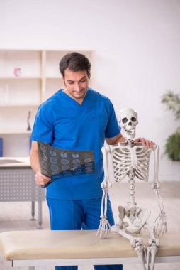 Young doctor and skeleton patient at the hospital