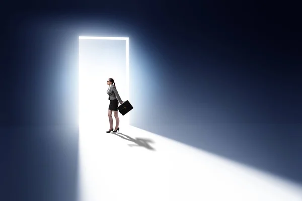 Businesswoman Entering Backlit Door Escape Concept — Stock Photo, Image