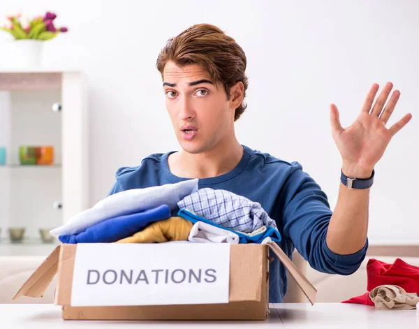 stock image The concept of charity with donated clothing