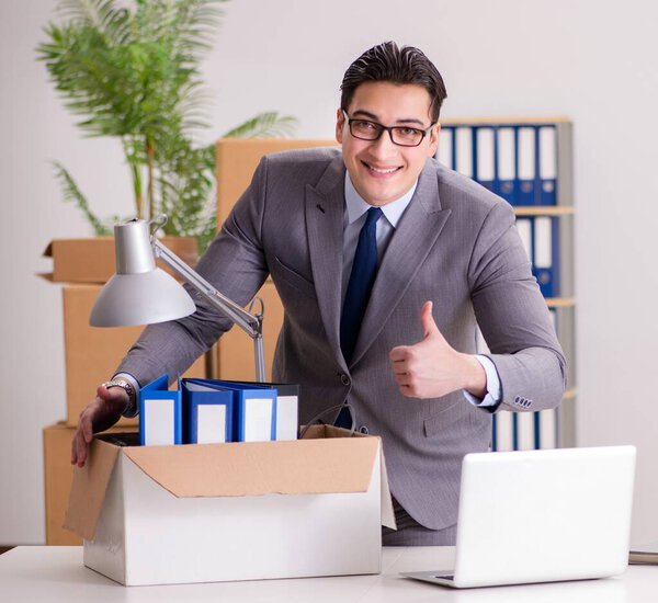 The young handsome businessman moving offices