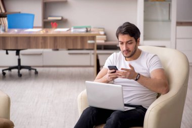Young employee working from home during pandemic