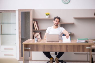 Young employee working from home during pandemic