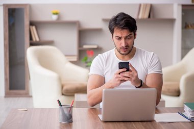Young employee working from home during pandemic