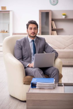 Young employee working from home during pandemic