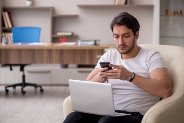 Young employee working from home during pandemic