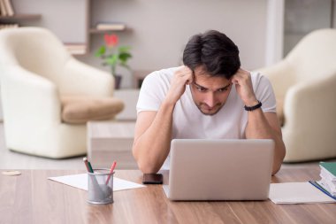 Young employee working from home during pandemic