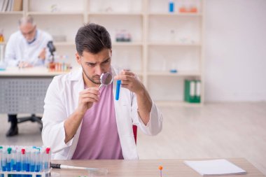 Two chemists working at the lab