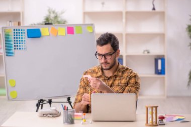 Young designer working at workplace