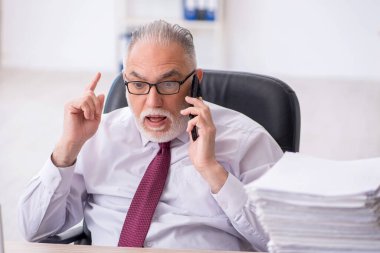 Old employee unhappy with excessive work at workplace