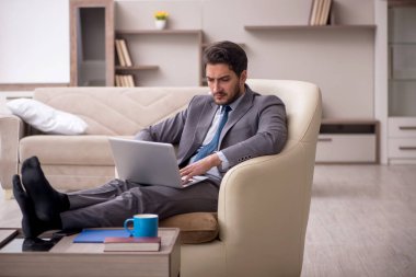Young employee working from home during pandemic